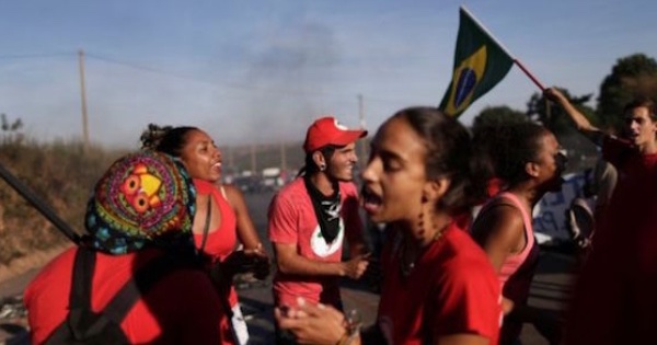 In Brasilia, members of the Landless MST workers movement join in protest.