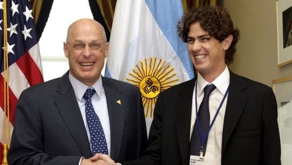 Former U.S. Treasury Secretary Henry Paulson (L) with Argentine Ambassador to the U.S. Martin Lousteau (R).