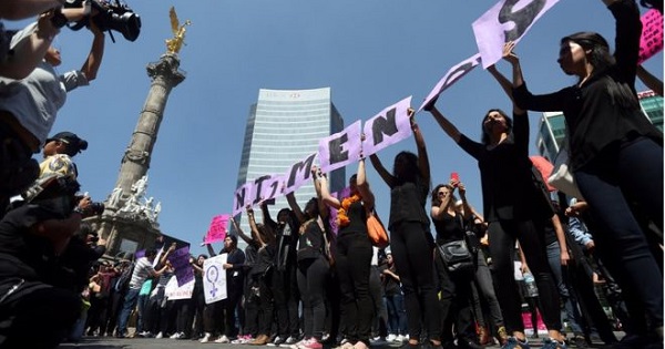 Women participate in a protest against femicide in Mexico City.