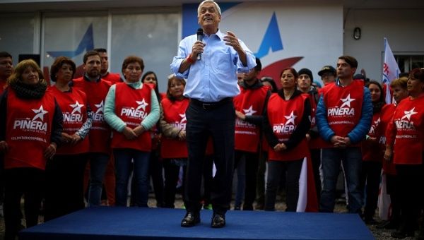 Former Chilean President Sebastian Piñera delivers a speech during a campaign rally in Santiago.