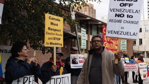 Protesters in Toronto decry the Lima Group's divisive actions.