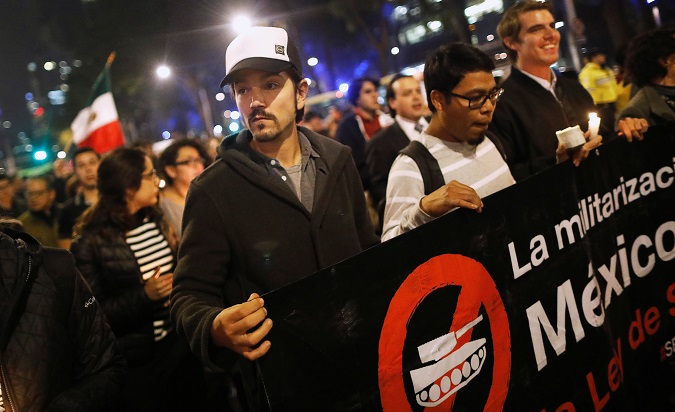 Mexican actor Diego Luna marches as he protests against a new security bill, Law of Internal Security, in Mexico City, Mexico, December 13, 2017.