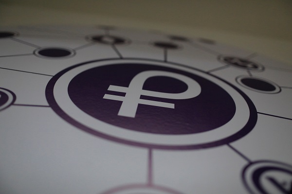 The new Venezuelan cryptocurrency 'Petro' logo is seen at a facility of the Youth and Sports Ministry in Caracas.