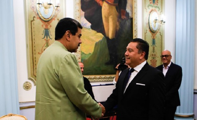 Presdent Nicolas Maduro (L) meets former candidate Javier Bertucci at Miraflores Palace in Caracas, Venezuela.