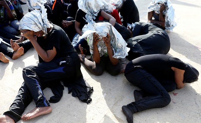 Migrants at a naval base after being rescued by Libyan coast guards in Tripoli, Libya, June 18, 2018.