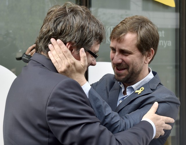 Antoni Comin welcomes former Catalan leader Carles Puigdemont at the Delegation of the Government of Catalonia in Brussels, Belgium.