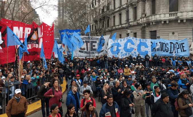 Workers march towards the presidential palace in Buenos Aires.