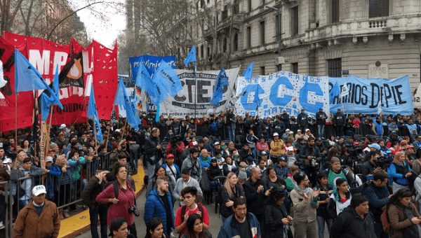 Workers march towards the presidential palace in Buenos Aires.