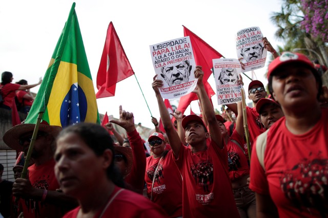 Supporters of imprisoned former Brazil's President Luis Inacio Lula da Silva attend a march before his Workers' Party (PT) officially registers his presidential candidacy, in Brasilia, Brazil, August 15, 2018.