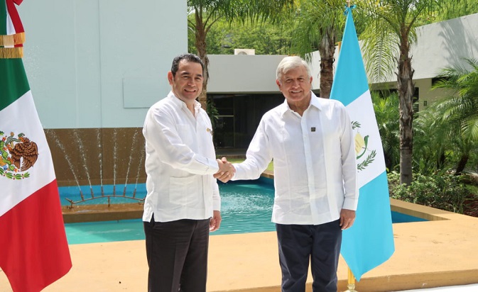 Guatemala's President Jimmy Morales shakes hands with Mexican president-elect Andres Manuel Lopez Obrador during a meeting in Tuxtla Gutierrez, Mexico, August 28, 2018.