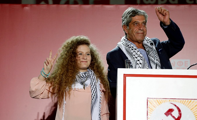 Palestinian teenager Ahed Tamimi attends the annual festival of Greek Communist Youth in Athens.