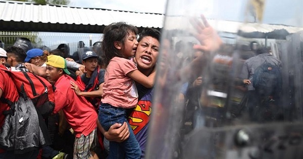 Families migrating from Honduras met heavily armed police at the Mexican border.