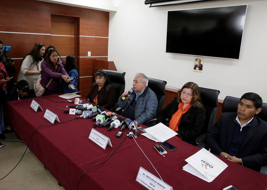 Members of the Supreme Electoral Tribunal attend a news conference after the resignation of the tribunal's president Katia Uriona in La Paz, Bolivia.