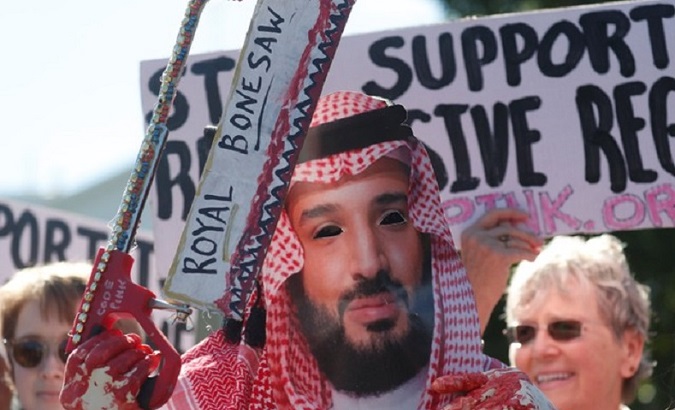 An activist dressed as Saudi Crown Prince Mohammad bin Salman holds a prop bonesaw during a demonstration calling for sanctions against Saudi Arabia outside the White House in Washington, U.S., Oct. 19, 2018.