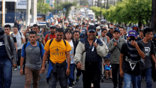 People walk in a caravan of migrants departing from El Salvador en route to the United States, in San Salvador, El Salvador, October 28, 2018. 