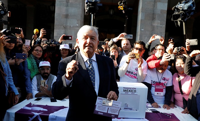 Mexico's President-Elect Andres Manuel Lopez Obrador talks to reporters before casting his vote in a public consultation. Oct. 25, 2018.