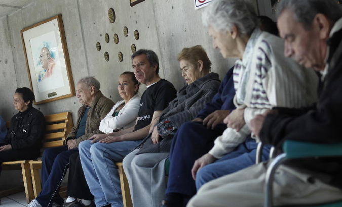 Patients with Alzheimer's and dementia sit inside an Alzheimer foundation in Mexico City April 19, 2012.
