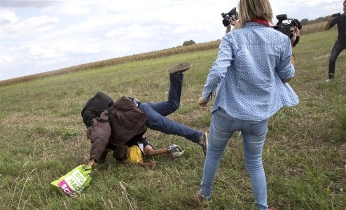 Laszlo made headlines for a man carrying a child as well as trying to trip or kicking other migrants.