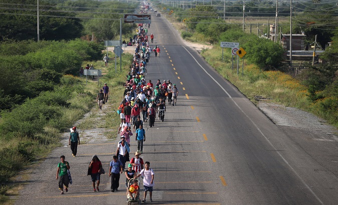 Migrants walk along the highway to Matias Romero from Juchitan.