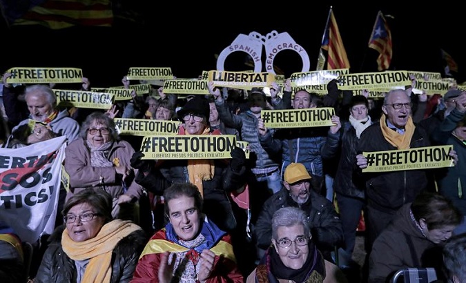 Catalans protesting at the first anniversary of the imprisonment of members of the previous government in the Lledoners Penitentiary Center.