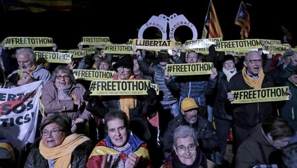 Catalans protesting at the first anniversary of the imprisonment of members of the previous government in the Lledoners Penitentiary Center.