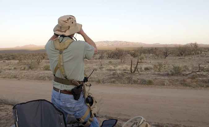 A member of a 'Minutemen' militia watches the Sonoran desert shared by Mexico and the U.S. April 7, 2008. Arizona.
