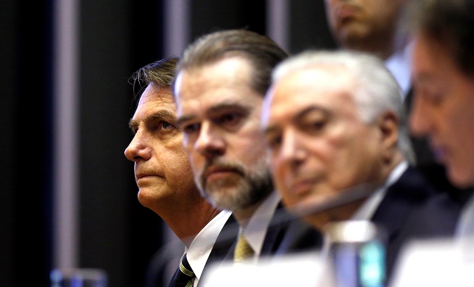 Brazil's President-elect Jair Bolsonaro (L), President of Brazil's Supreme Federal Court Dias Toffoli (C) and Brazil's President Michel Temer attend a session at the National Congress in Brasilia, Brazil November 6, 2018.