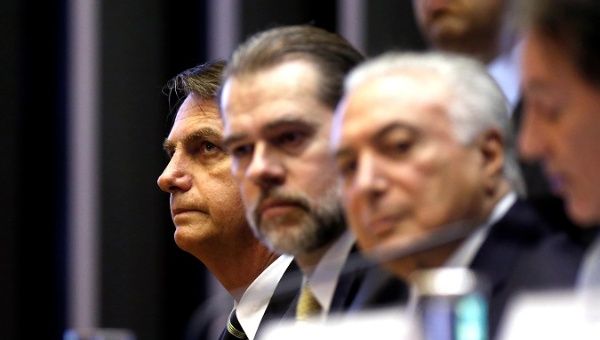 Brazil's President-elect Jair Bolsonaro (L), President of Brazil's Supreme Federal Court Dias Toffoli (C) and Brazil's President Michel Temer attend a session at the National Congress in Brasilia, Brazil November 6, 2018. 