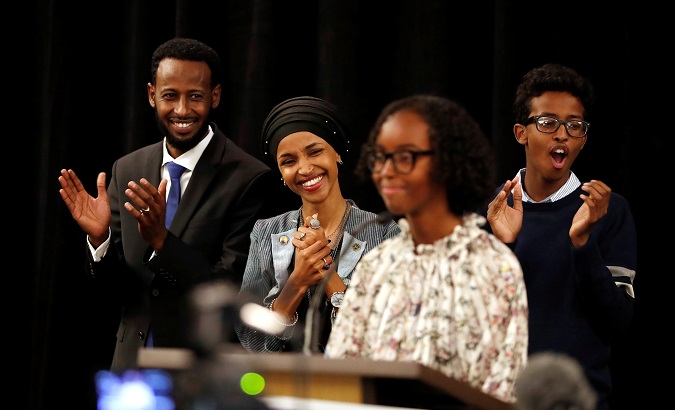 Democratic congressional candidate Ilhan Omar listens as she is introduced by her daughter, Isra at her election night party in Minneapolis. November 7, 2018.