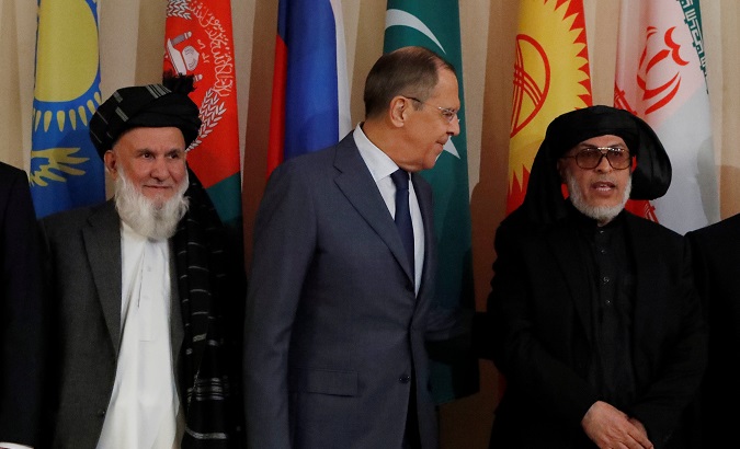 Head of the Afghanistan delegation and Deputy Chairman of High Peace Council, Hajji Din Mohammad; Russian Foreign Minister Sergei Lavrov; and Head of the Taliban’s political council in Qatar, Sher Mohammad Abbas Stanakzai pose during multilateral peace talks on Afghanistan in Moscow, Russia on November 9, 2018.