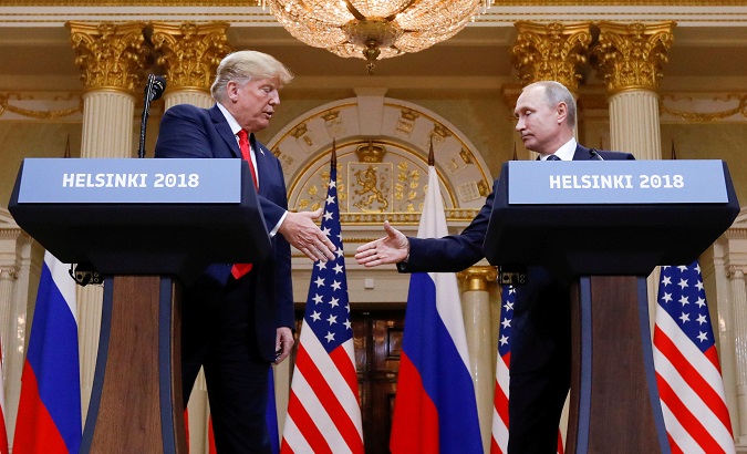 U.S. President Donald Trump and Russia's President Vladimir Putin shake hands during a joint news conference after their meeting in Helsinki, Finland on July 16, 2018.