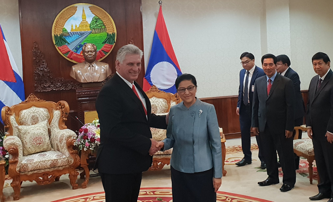 Pany Yathotou, president of the National Assembly of Laos (R) greeting Cuban President Diaz-Canel.
