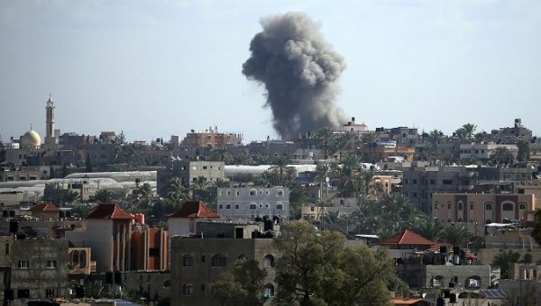 Smoke rises following an Israeli air strike in northern Gaza Strip
