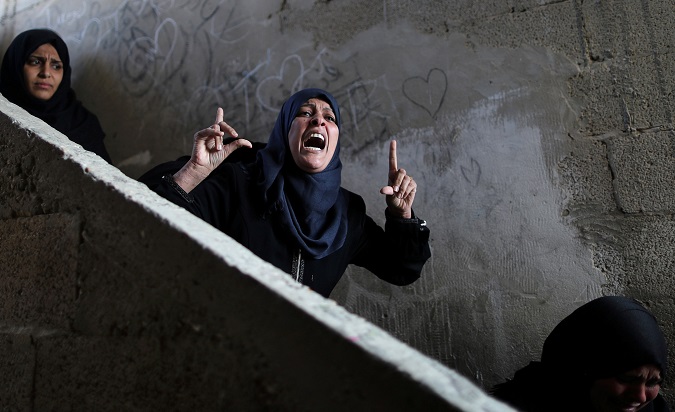 A relative of Palestinian Khaled Qwaider, who was killed in an Israeli air strike, reacts during his funeral, in Khan Younis in the southern Gaza Strip November 12, 2018.