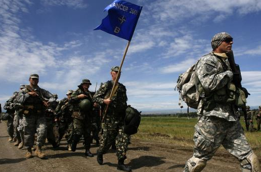 A U.S. soldier leads military men from various countries during a NATO exercise in 2017
