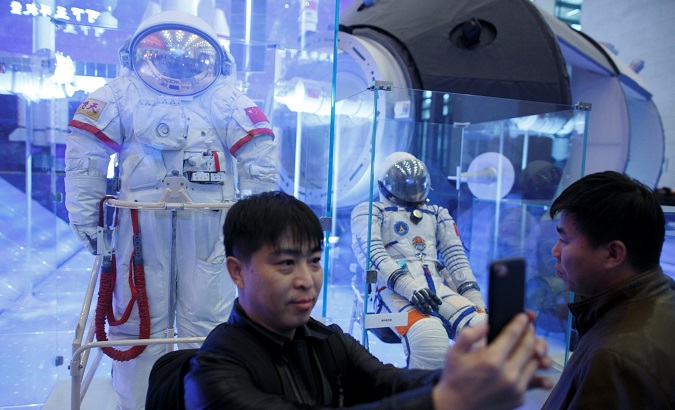 A visitor takes a selfie at an exhibition marking the 40th anniversary of reforms at the National Museum in Beijing, China on Nov. 14, 2018.