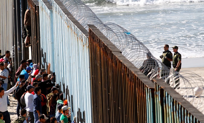 Central American Exodus, migrant caravan, members reach the U.S. border fence between Mexico and the United States, in Tijuana, Mexico Nov. 14, 2018.