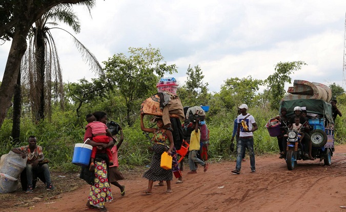 Congolese migrants expelled from Angola walking to Tshikapa in Kasai province, near the border with Angola in the Democratic Republic of the Congo, Oct. 13, 2018.