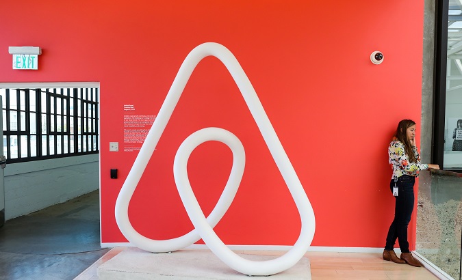 A woman talks on the phone at the Airbnb office headquarters in the SOMA district of San Francisco, California, U.S.
