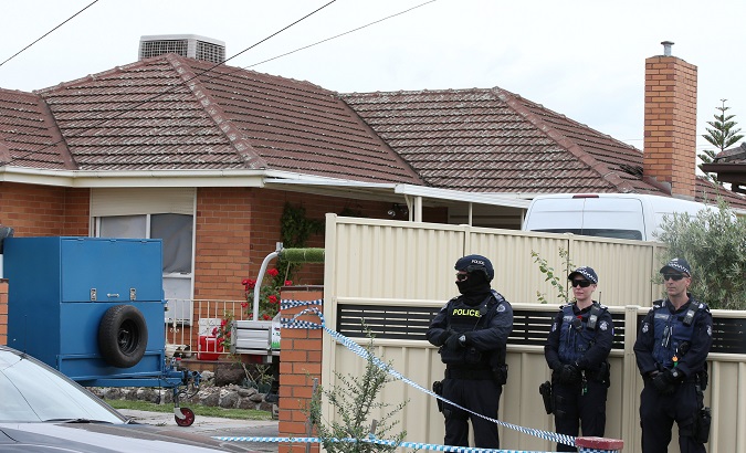 Police are seen outside one of the houses involved in counter-terrorism raids across the north-western suburbs in Melbourne 19/11/2018 20:32.