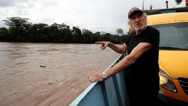 Pink Floyd's Roger Waters visits with communities in the Ecuadorean Amazon affected by Chevron's contamination.