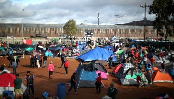 The migrants occupy a make-shift camp