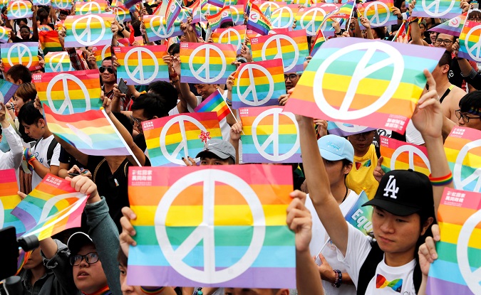 Same-sex marriage supporters take part in a LGBT pride parade after losing in the marriage equality referendum, in Kaohsiung