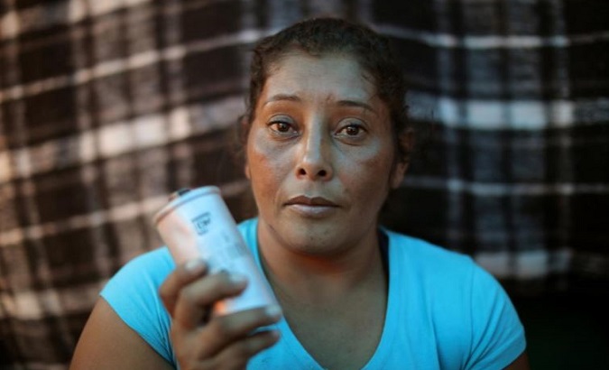 Maria Meza, 35, said one of her children nearly fainted after a canister landed near him.