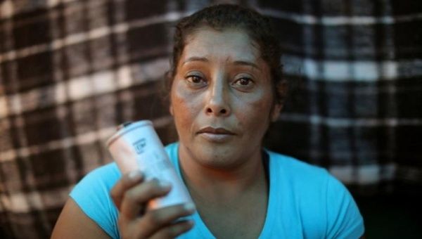 Maria Meza, 35, said one of her children nearly fainted after a canister landed near him.