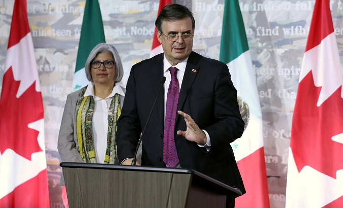Incoming Mexican Foreign Minister Marcelo Ebrard speaks during a news conference in Canada. Next to him is incoming Mexican Economy Minister Graciela Marquez.