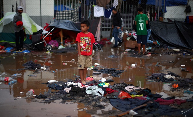 A migrant boy stands in a temporary in Tijuana, Mexico on Nov. 29, 2018.