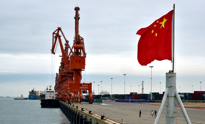 A Chinese national flag flies at a port in Beihai, China.
