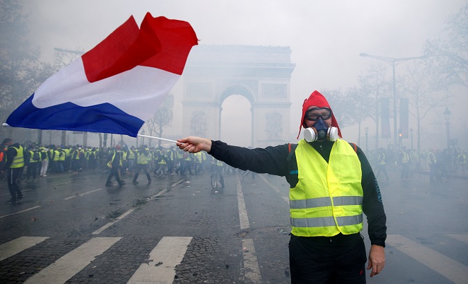 A protester in a yellow vest, symbol of the French drivers' protest against higher diesel taxes, in Paris, December 1, 2018.
