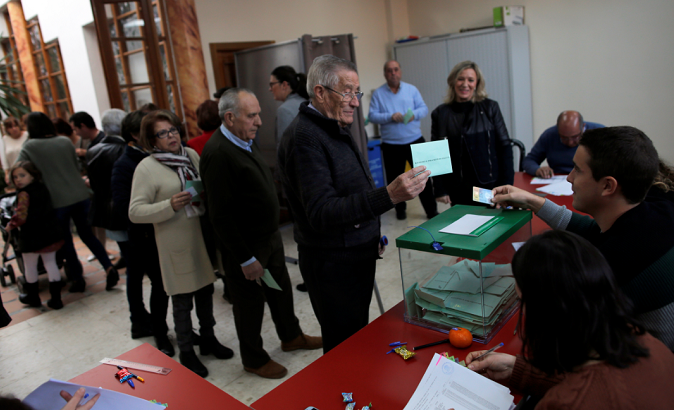 People wait in line to cast their ballots for the Andalusian regional elections at a polling station in Cuevas del Becerro, Spain, Dec. 2, 2018